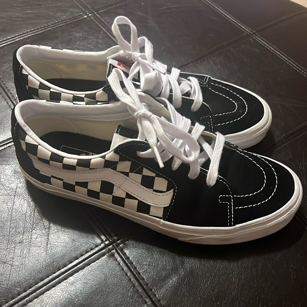 Vans men’s sneakers. Preowned but worn only one time. Size 8.5. NO BOX.